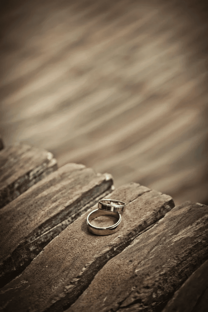 Wedding ring resting on weathered wood